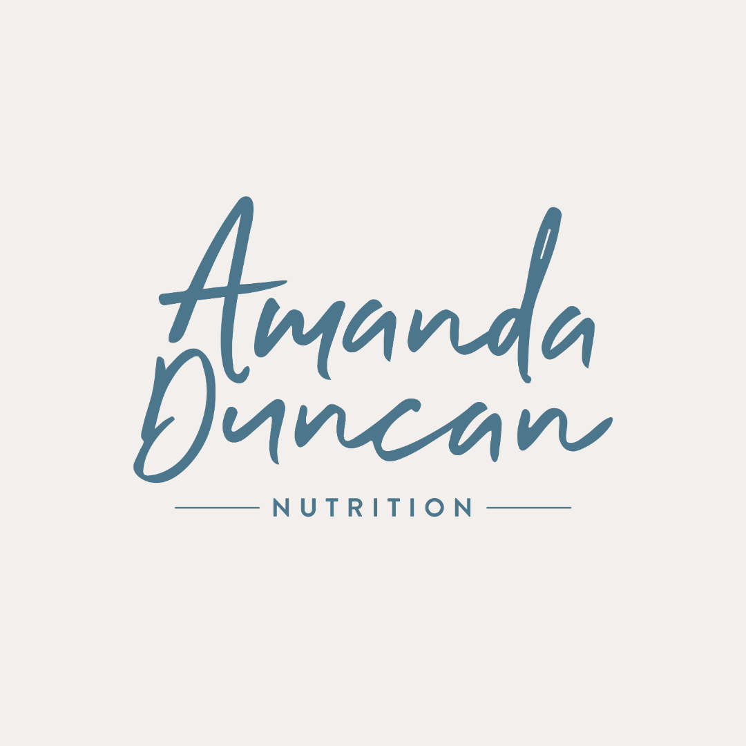 Amanda Duncan Logo, written in blue on cream background.