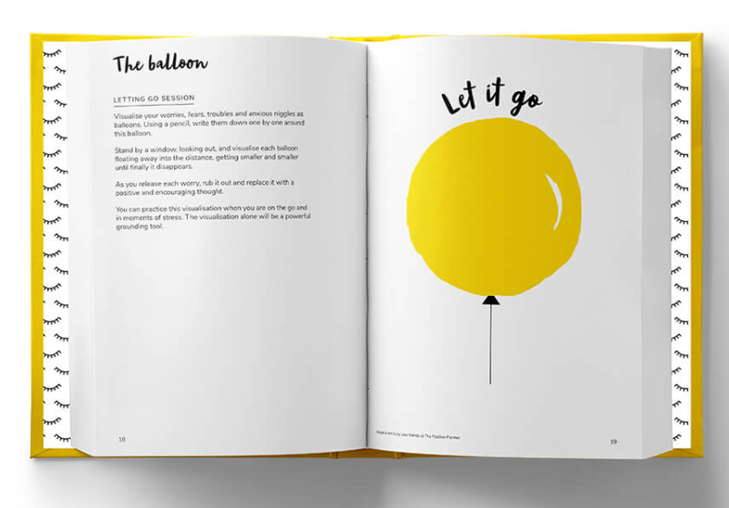 The positive planner journal lying open at the balloon, let it go page